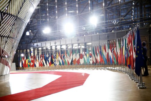 Brussels, Belgium. 14th March 2019. Flags of participants at an international conference on the future of Syria and the region.