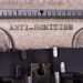 The inscription "Antisemitism" written on a gray sheet with a typewriter font.