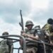 Armed police officers guarding outside the High Court in Dar es Salaam, Tanzania on October 20, 2021
