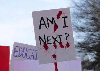 Washington, DC USA - March 24, 2018: A large group of people carrying signs march in the March for Our Live protest.