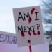 Washington, DC USA - March 24, 2018: A large group of people carrying signs march in the March for Our Live protest.