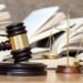 wooden gavel and books on wooden table