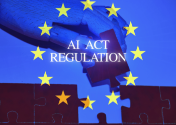 AI regulation symbol. Concept words AI artificial intelligence act regulation , robot hand on beautiful puzzle jigsaw. Business AI artificial intelligence regulation concept with the European flag .