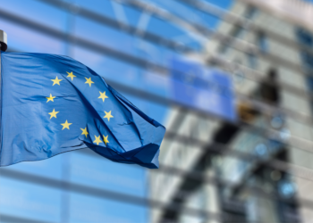 European Union flag in front of the Berlaymont building (European commission) in Brussels, Belgium.