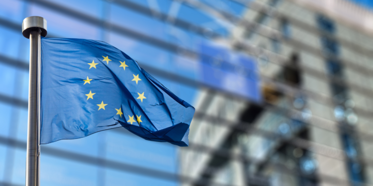 European Union flag in front of the Berlaymont building (European commission) in Brussels, Belgium.
